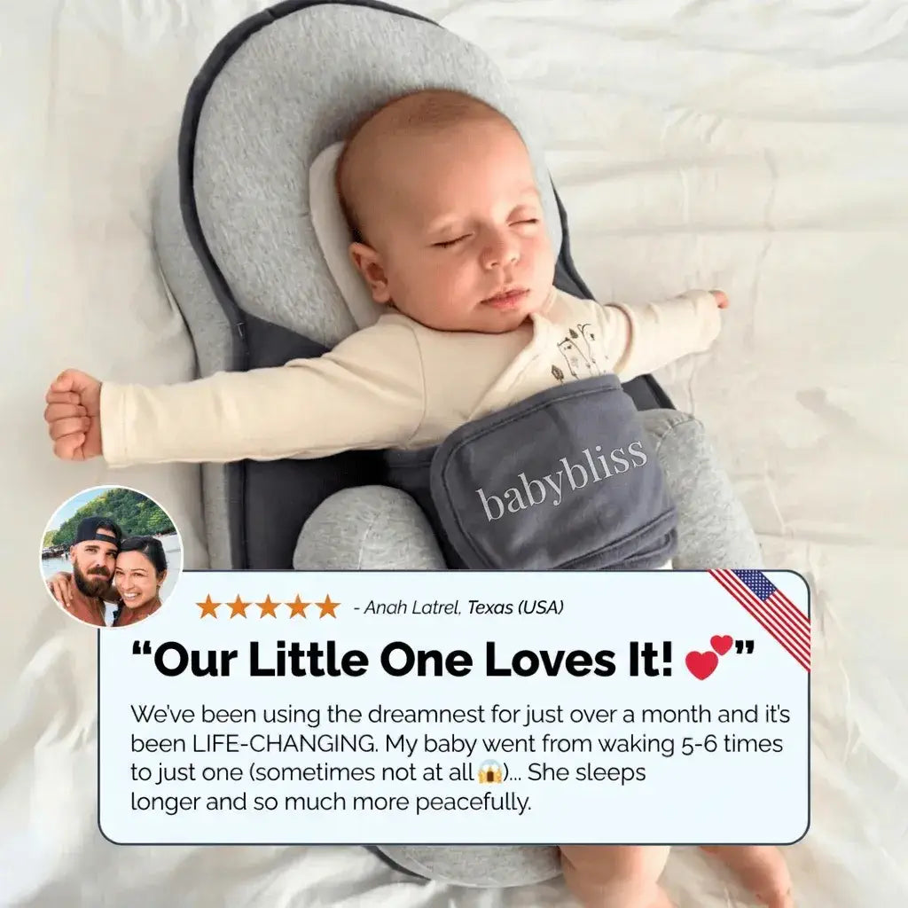 Baby sleeping in a gray baby wrap with a review text overlay on a white background